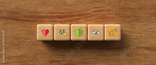 Slika na platnu cubes with health icons on wooden background