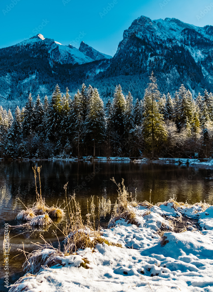Beautiful winter landscape with reflections at the famous Hintersee, Ramsau, Berchtesgaden, Bavaria, Germany