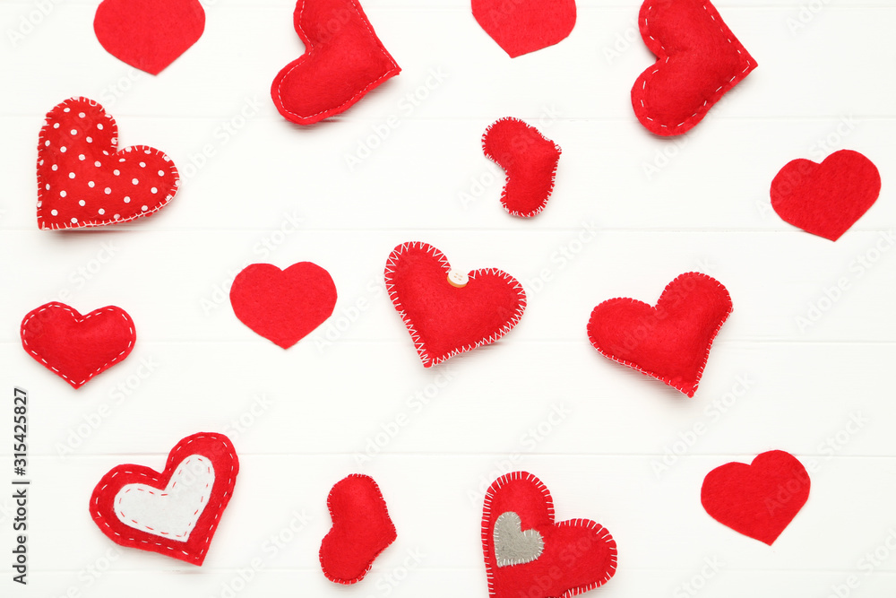 Fabric hearts on white wooden table