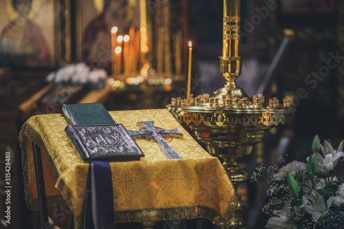 Church ordinance orthodox and wedding, church wedding, religious of a child in church, icons, Orthodox church, candles, interior of the Orthodox Church, bible, font