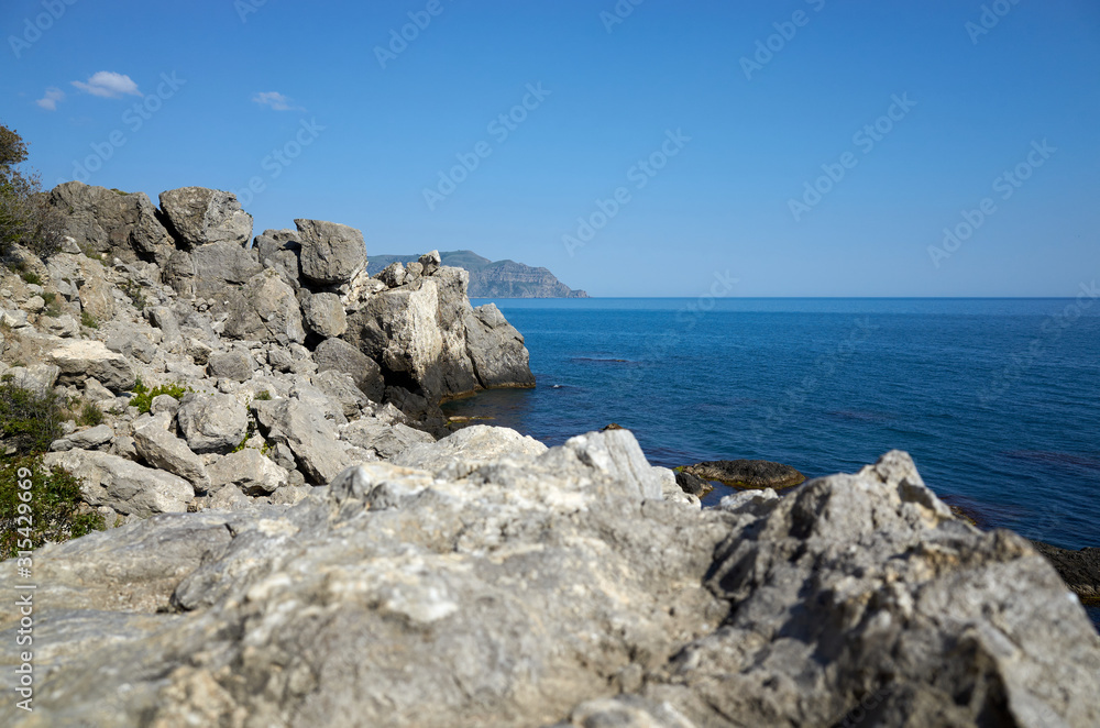 The rocky coast of the Black Sea. Cape Alchak in Sudak, Crimea The rocky coast of the Black Sea. Cape Alchak in Sudak, Crimea