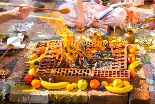 Indian wedding ritual, beautiful bonfire decorated with fruit.