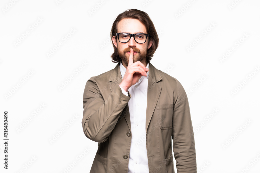 Business man with finger on lips asking for silence over white background Business man with finger on lips asking for silence over white background