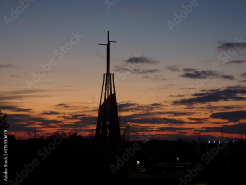 silhouette of a church at sunset