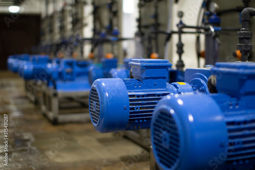 The engine room at the treatment facilities .Equipment inside the industrial premises .