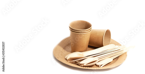 Eco-friendly, disposable, recyclable, compostable dishes. Paper boxes, glasses. Spoons, forks, knives, wooden. Utensils on a white background. photo