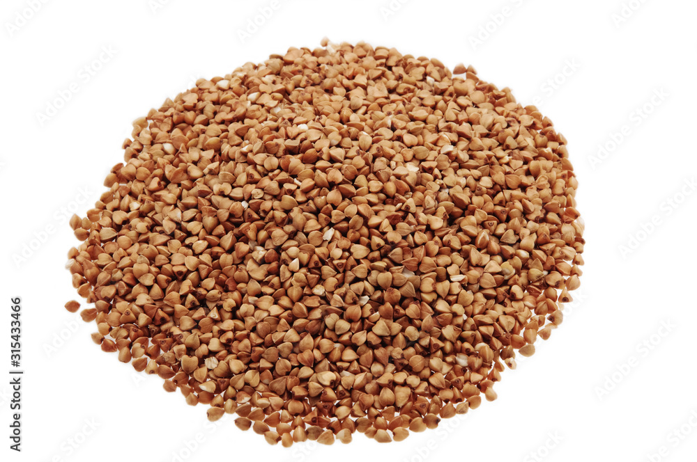 The buckwheat is scattered on a white background isolated.