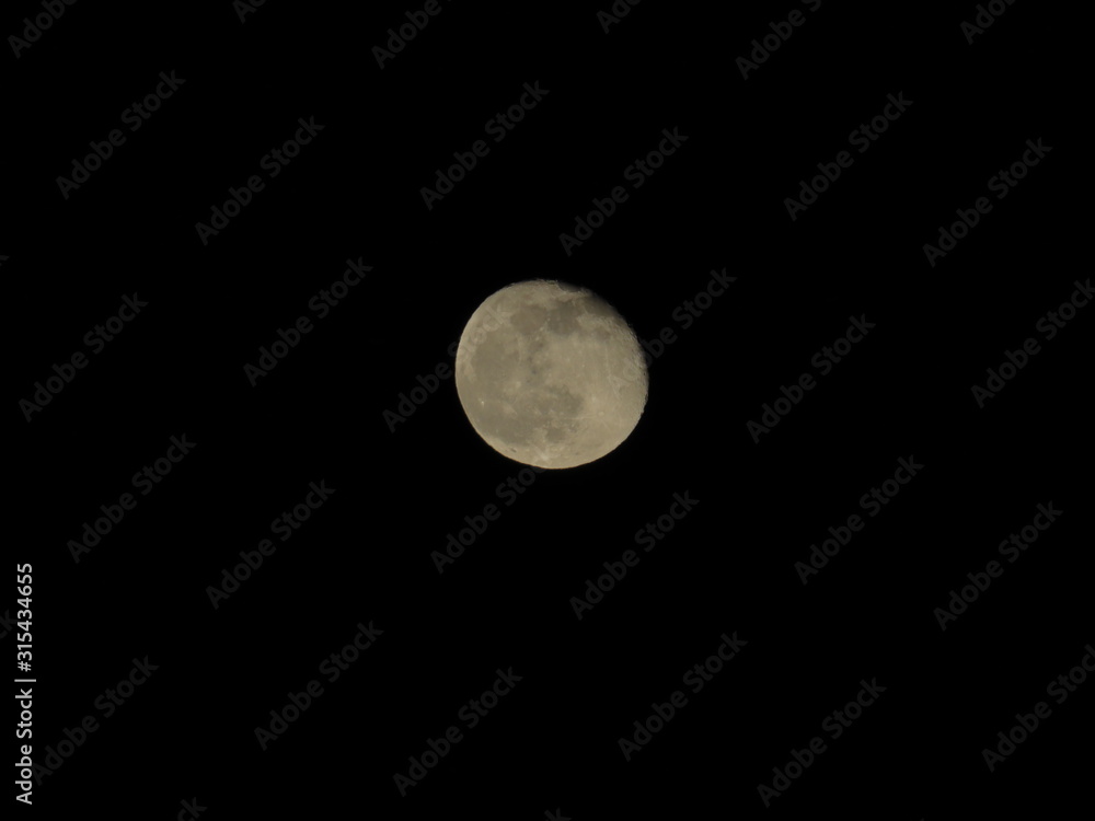 Moon With Clouds In The Night Sky. Concept of a spooky theme and mystery. Moon With Clouds In The Night Sky. Concept of a spooky theme and mystery.