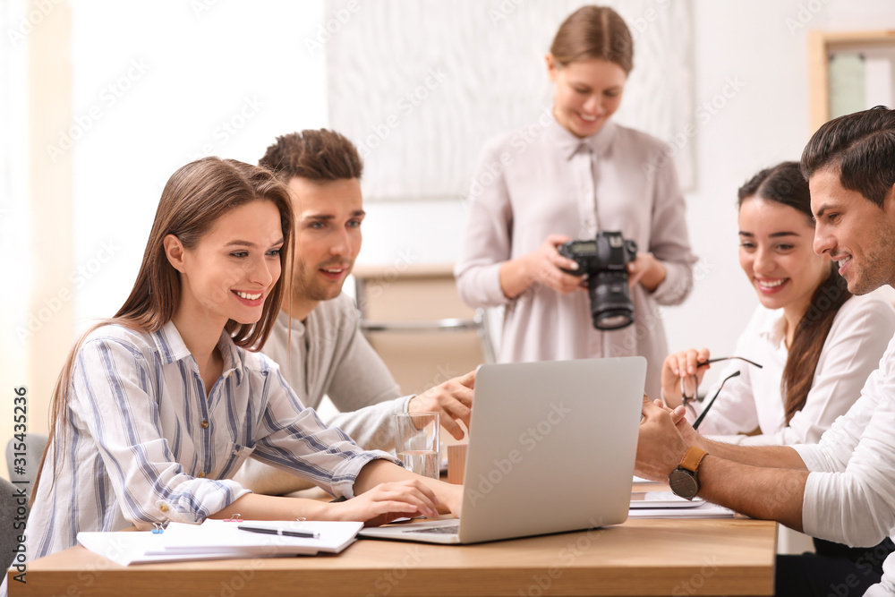 Team of professional journalists working in office Team of professional journalists working in office