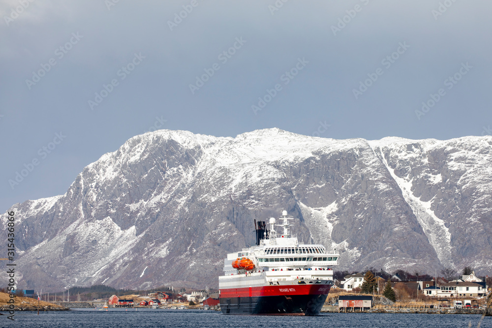 Coastal passenger ship arrives at Bronnoysund harbor, in northern Norway