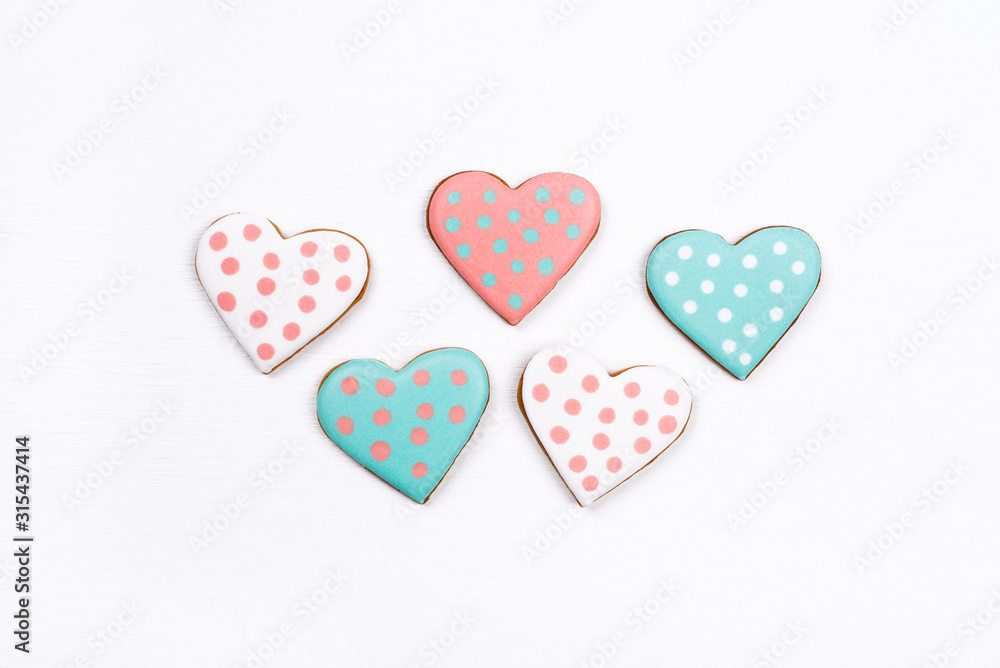 Gingerbread cookies with frosting in the shape of a heart. Valentines day concept. Flat lay, top view.