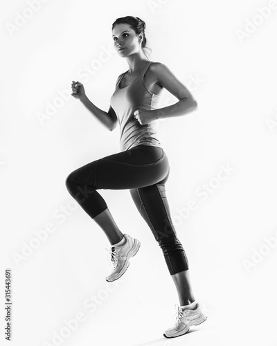 full-length photo of running woman over white background