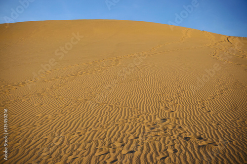 Sundown over desert landscape. Sand dunes