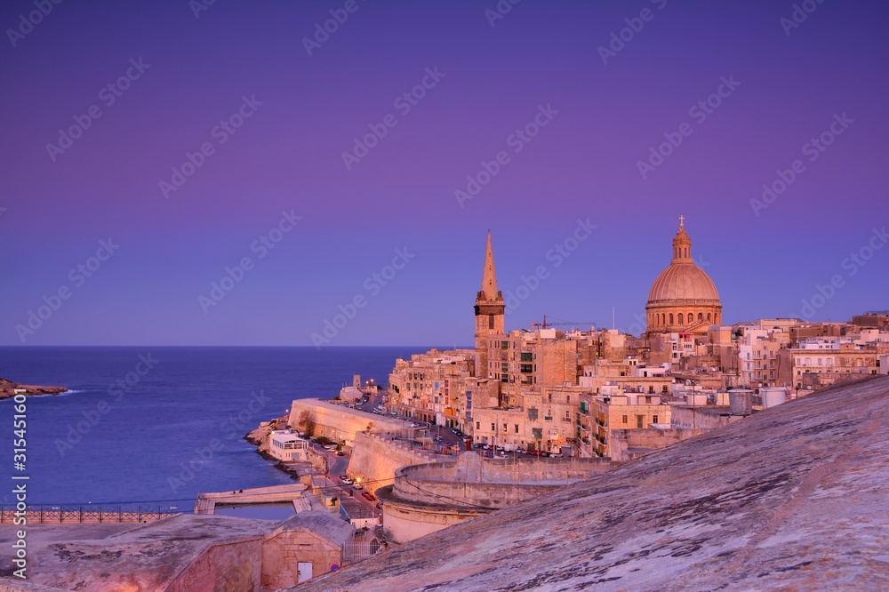 Fototapeta premium Church of Our Lady of Mount Carmel and St. Paul's Cathedral in Valletta, Malta.
