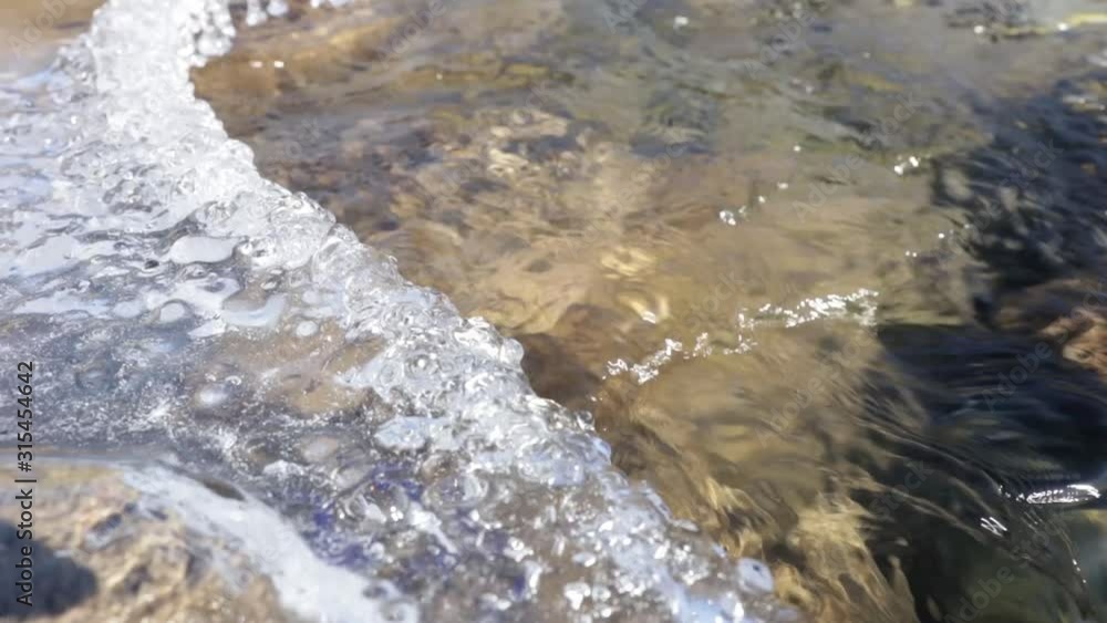 clear bubbling water of a mountain river. Spring flood. Background footage. clear bubbling water of a mountain river. Spring flood. Background footage.