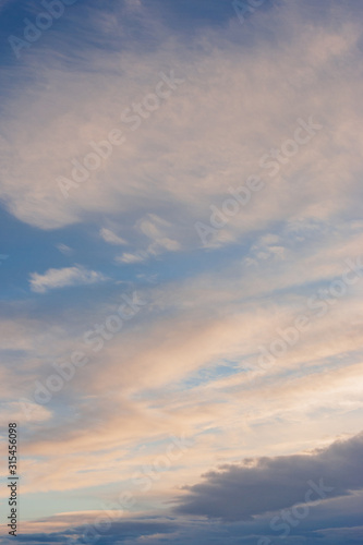 Cirrus clouds against the blue sky in summer