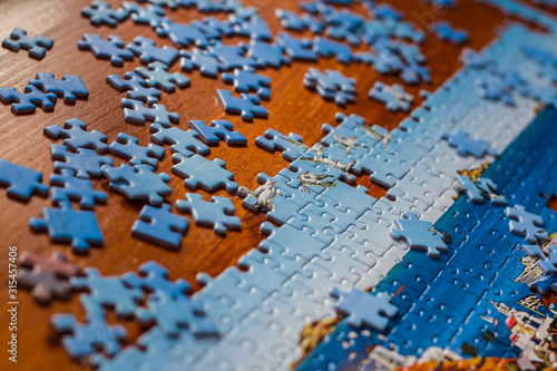 Partially solved jigsaw puzzle photo