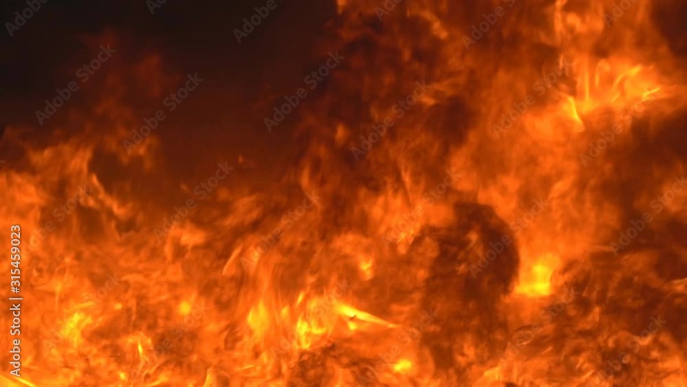 Slow motion fire concept, Fire flame close up  burning super Slow motion.It real fire flame on campfire is rapid oxidation material in exothermic chemical process of combustion releasing heat light