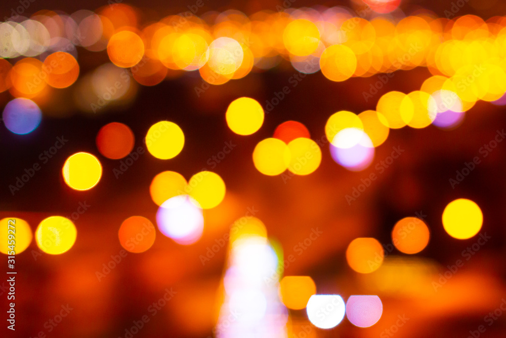Obraz premium Colorful bokeh defocused blurred lights of cityscape. Abstract background