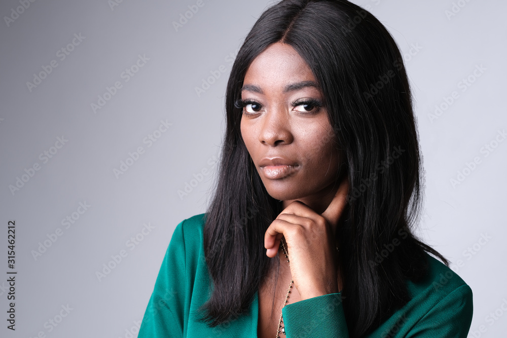 Beautiful face of african-american model on photoshoot. Model wearing a bottle green color and lots fabulous. Beautiful face of african-american model on photoshoot. Model wearing a bottle green color and lots fabulous.