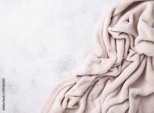 Gray blanket on light background photo