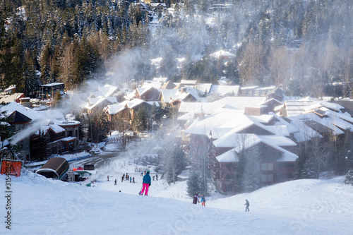 View from above of Creekside Village during a sunny winter day. Taken from Whistler Mountain, British Columbia, Canada. photo