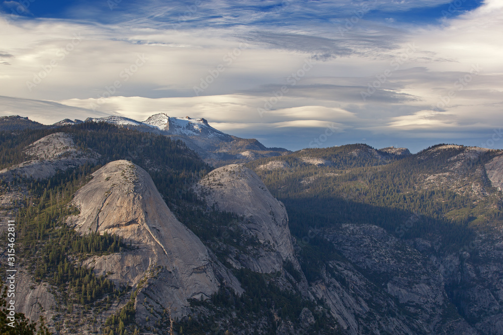 Landscape of the Sierra Nevada Mountains with beautiful clouds from Glacier Point, Yosemite National Park, California USA