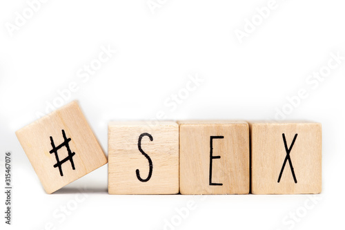 Wooden cubes with a Hashtag and the word Sex isolated on white background, social media concept