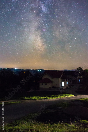 Milky way over village © Cladosa
