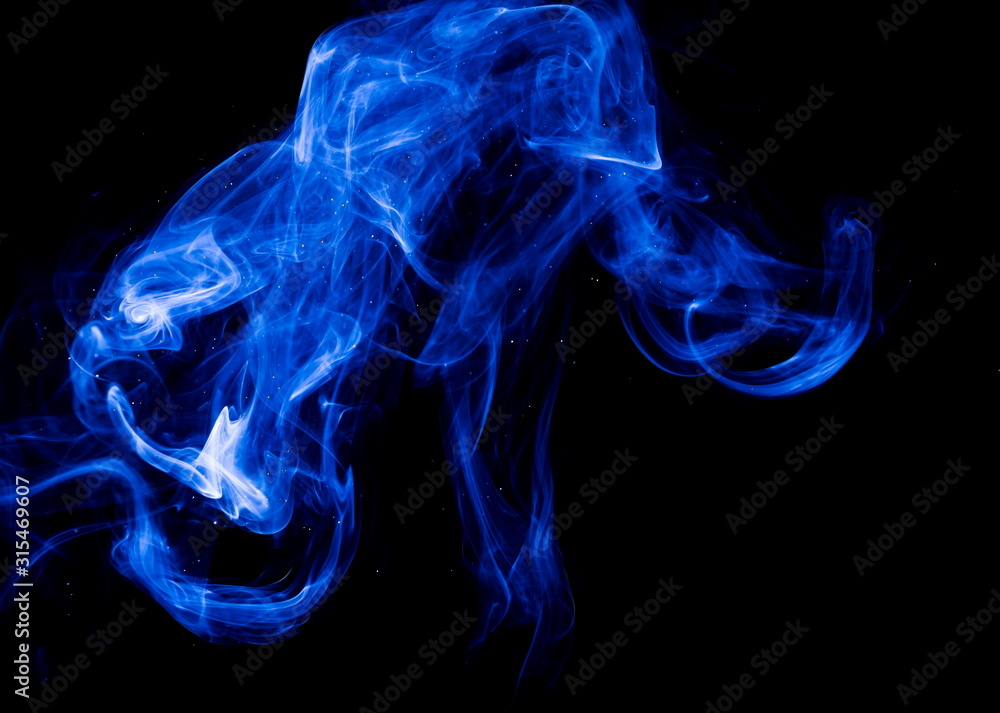Fototapeta premium Blue smoke on black background