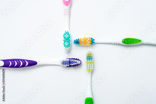 Various toothbrushes on a white background.