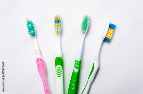 Various toothbrushes on a white background.