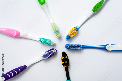 Various toothbrushes on a white background.