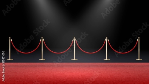 Red carpet in a dark room with spotlights and fences