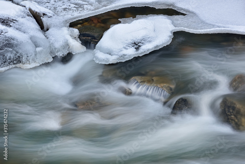 Winter landscape of Clear Creek captured with motion blur, Rocky Mountains, Colorado, USA