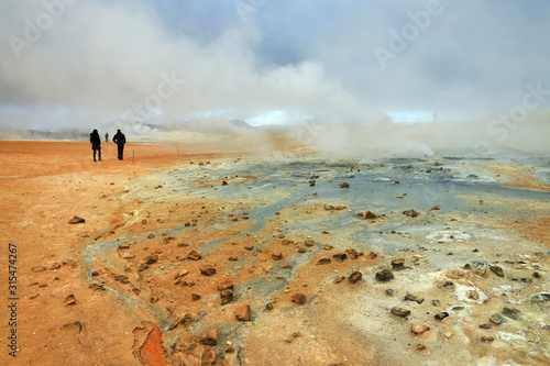 Schilderij op canvas Tourists visiting the geothermal region of Hverir in Iceland near Myvatn Lake, I