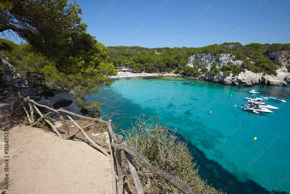 The footpath along Cala Macarella in Menorca,Balearic Islands, Spain The footpath along Cala Macarella in Menorca,Balearic Islands, Spain