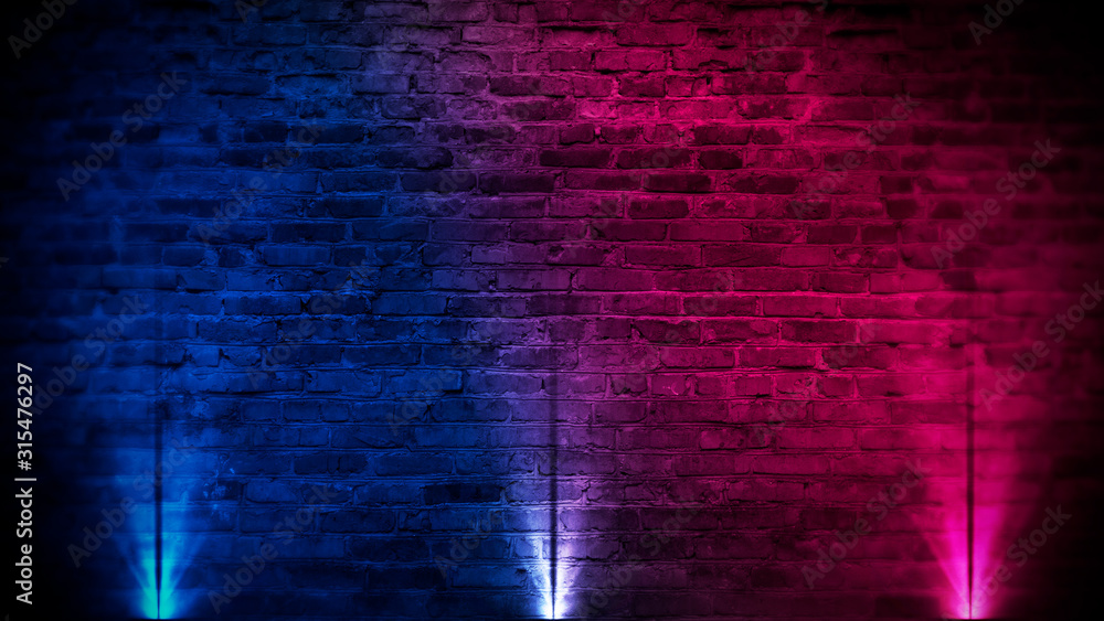 Obraz premium Old brick wall with neon lights. Neon shapes on brick wall background. Dark empty room with brick walls.