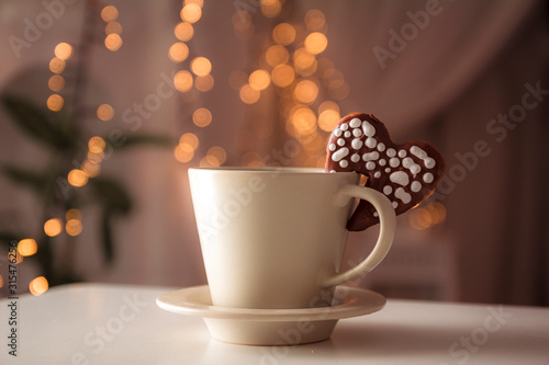 Cup of coffee with a sweet cookie