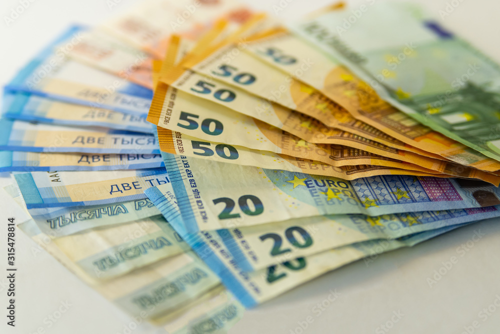 Background of euro banknotes and Russian rubles. Currency rate Background of euro banknotes and Russian rubles. Currency rate