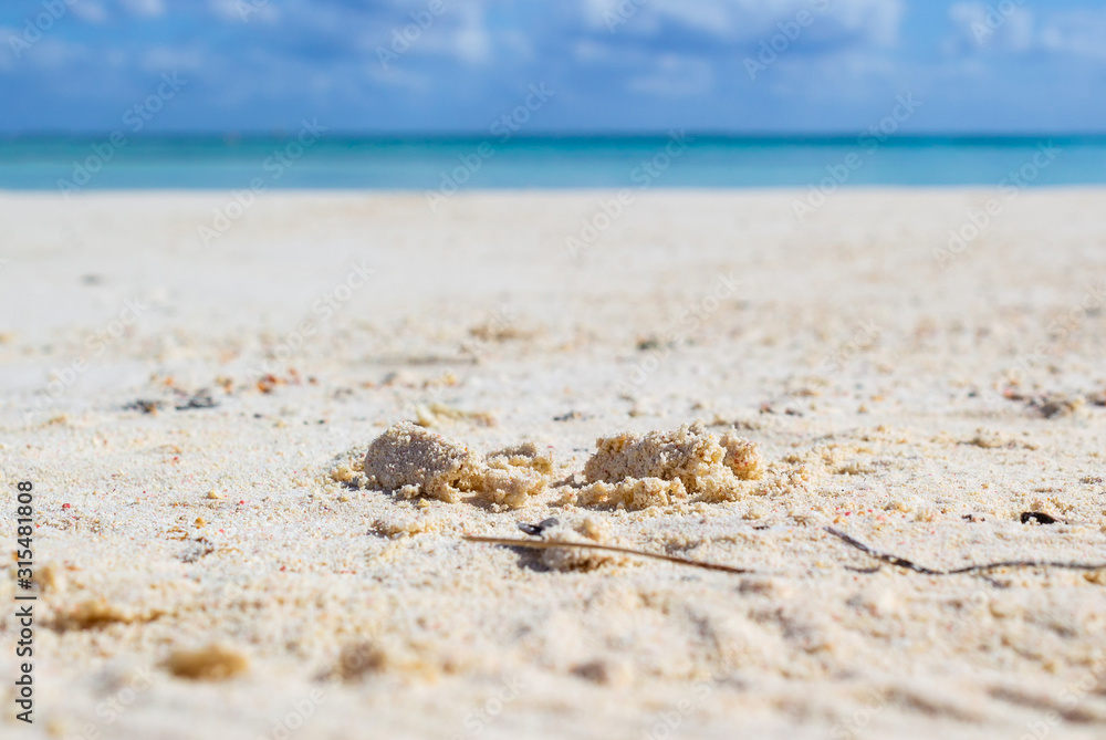 Detail of the white and fine sand of a tropical beach. Detail of the white and fine sand of a tropical beach.