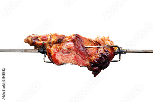 Barbecue leg on skewer isolated on white background. Barbecue grill