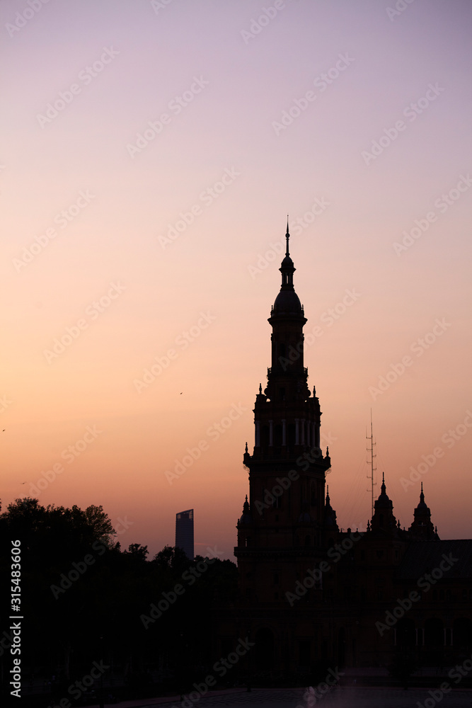 The tower at sunset in Plaza de España (Spain Square) in Seville, Spain