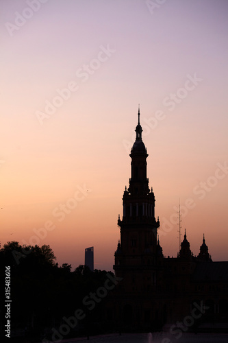 The tower at sunset in Plaza de España (Spain Square) in Seville, Spain