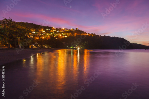 Landscape view of Anse a l   Ane beach and calm bay at colorful dusk with peaceful Caribbean sea  Martinique island