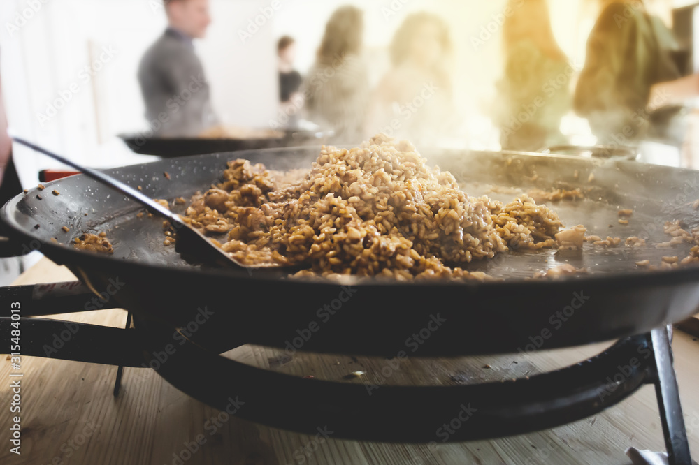 Paella pan with traditional Spanish food usually prepared with rice, meat, seafood