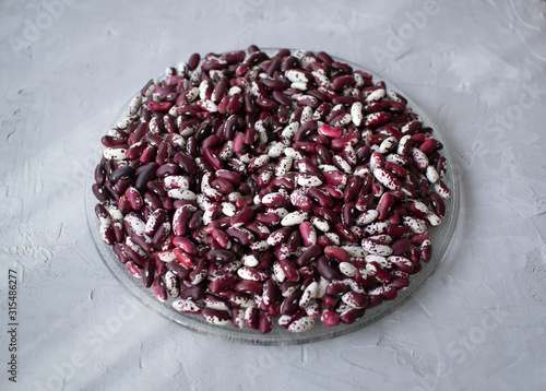 White and red beans on a gray background. Beans are a healthy, tasty and satisfying product. Clouse up.  photo