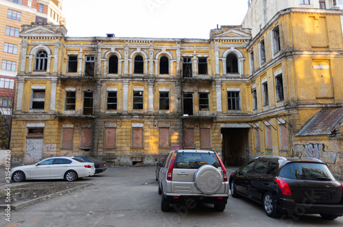 Old abandoned house in the city center. Two-storey old house without glass.