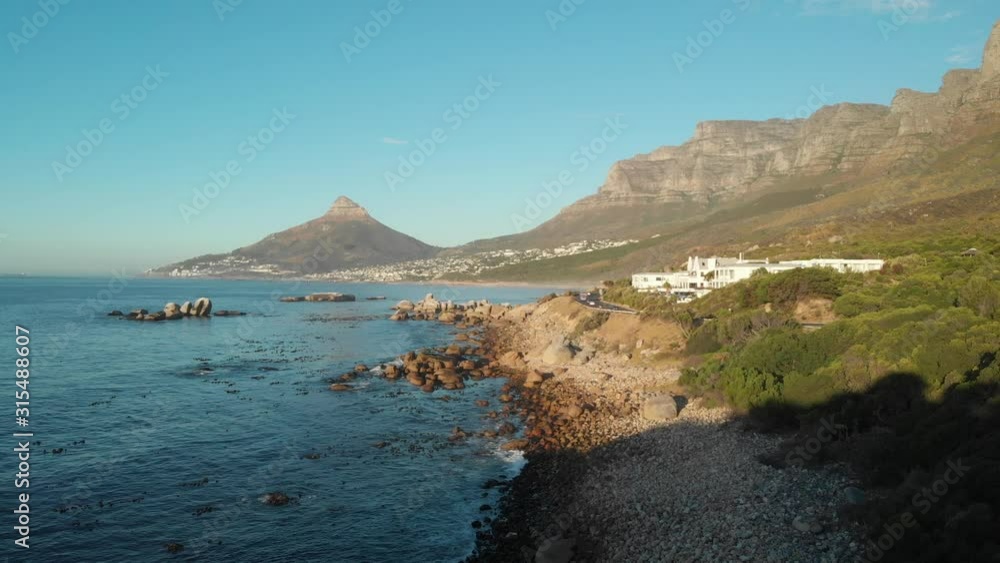 sunset beach flyover with waves Table mountain and lions head sunset beach flyover with waves Table mountain and lions head