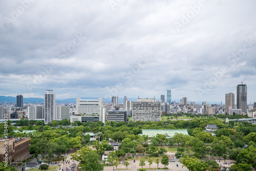 Cityscapes of the skyline in Osaka  with garden park in foreground